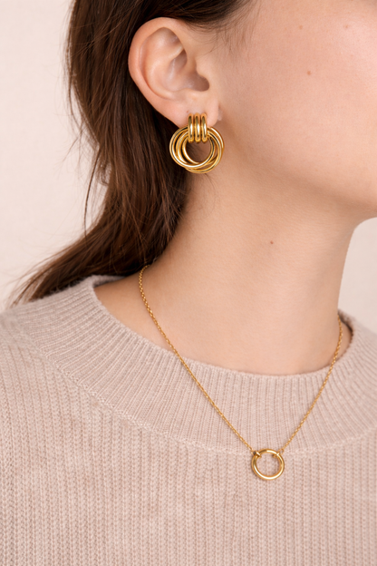LUMHARA 18K gold plated hoop earrings and matching circle necklace on model